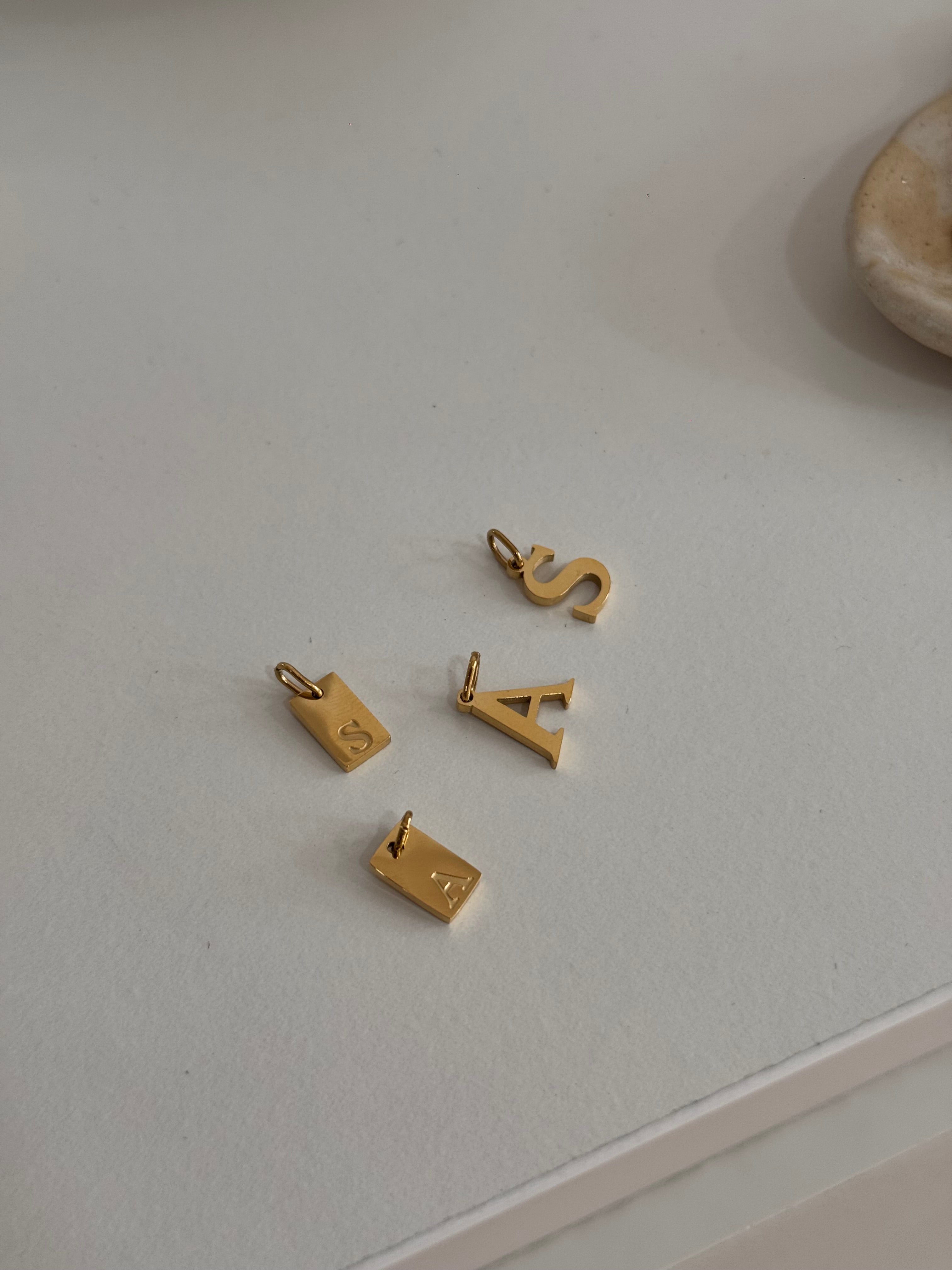 Charm Iniciales